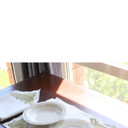 Elevate Your Eid Table with PTH Homes' Royal Gold Embroidered Table Linen Collection