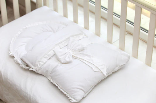 Introducing the White Bow Tie Sleeping Bag by PTH Homes: The Perfect Slumber Companion for Your Little One